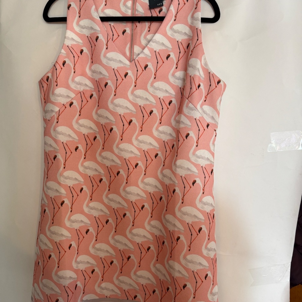 Pink Sleeveless Dress with white flamingos pattern.